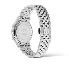 Detail view of the Daniel Wellington Iconic Chronograph Arch watch showing the engraved case back and polished silver 5-link bracelet.