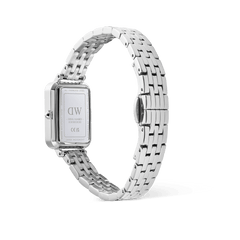 Engraved case back of the Daniel Wellington Quadro Roman Numerals Date watch, showing the silver 5-link strap and butterfly buckle.