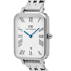 Close-up of the Quadro Roman Numerals Date watch by Daniel Wellington, featuring a rectangular silver case, white guillochÃ© dial with vibrant blue hands, and a polished 5-link steel bracelet.