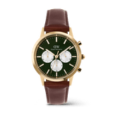 Daniel Wellington Iconic Chronograph watch with an emerald green panda dial, gold case, and a brown leather strap.