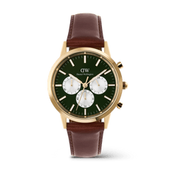 Daniel Wellington Iconic Chronograph watch with an emerald green panda dial, gold case, and a brown leather strap.