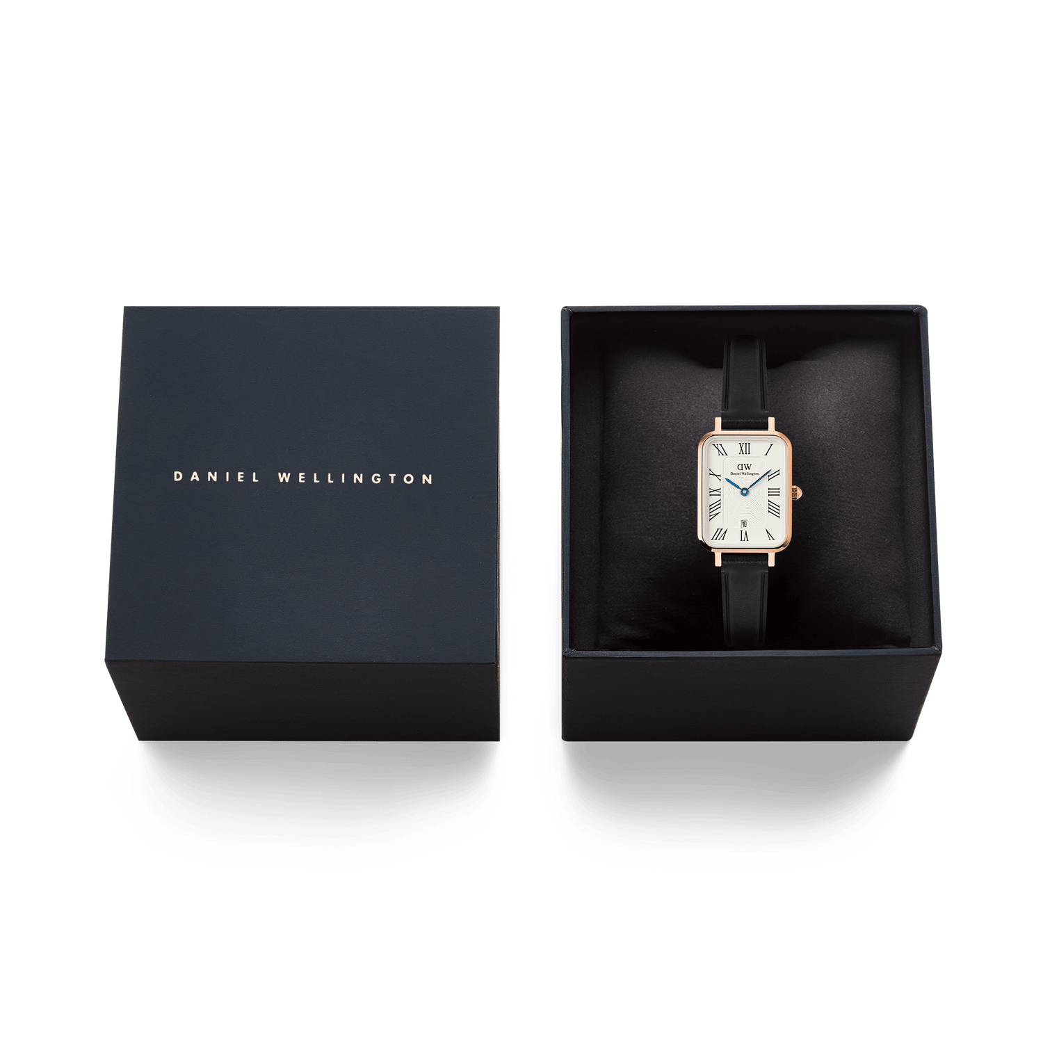 Daniel Wellington Quadro Roman Numerals Date watch in rose gold with a white dial and black Sheffield leather strap, presented in its official black box.